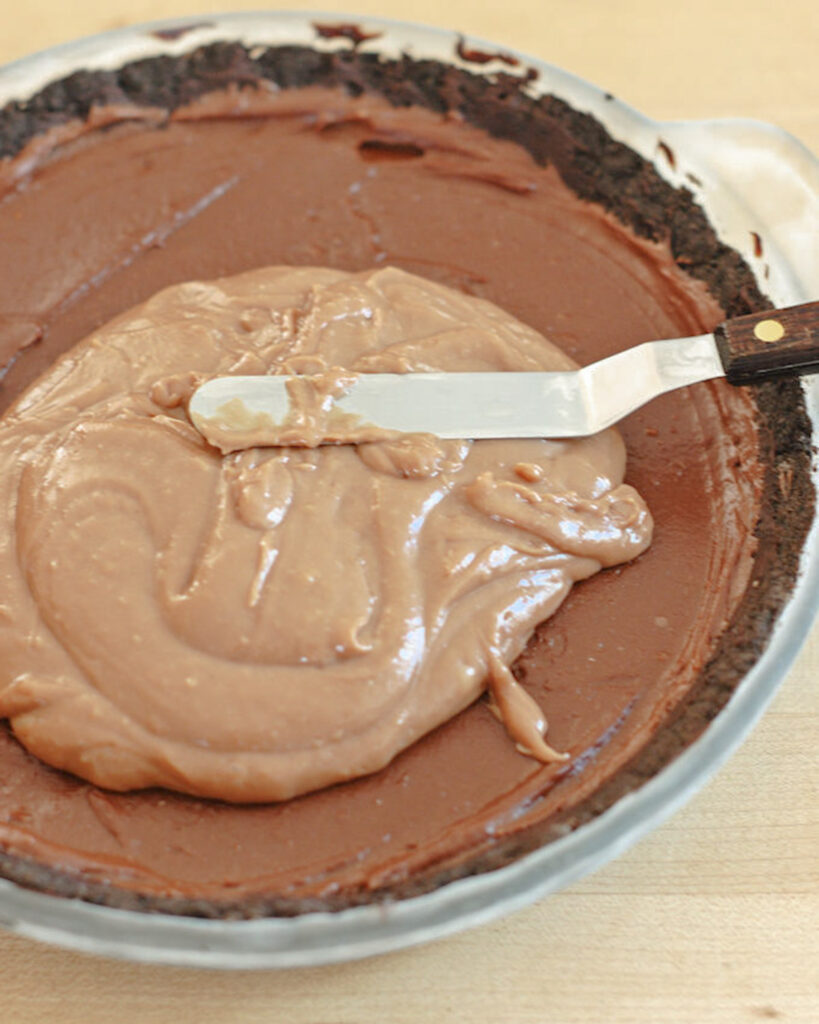 a pie shell filled with chocolate cream. 