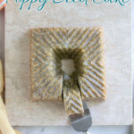 A pinterest image for citrus poppy seed cake with text overlay.