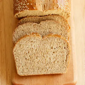 a sliced loaf of whole wheat bread.