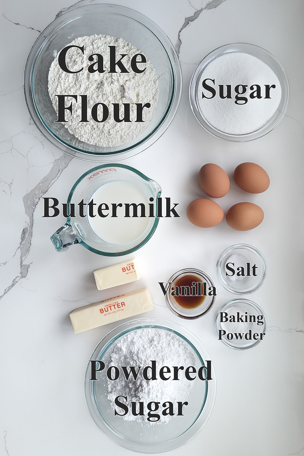 ingredients for buttermilk bundt cake with buttermilk glaze in glass bowls. 