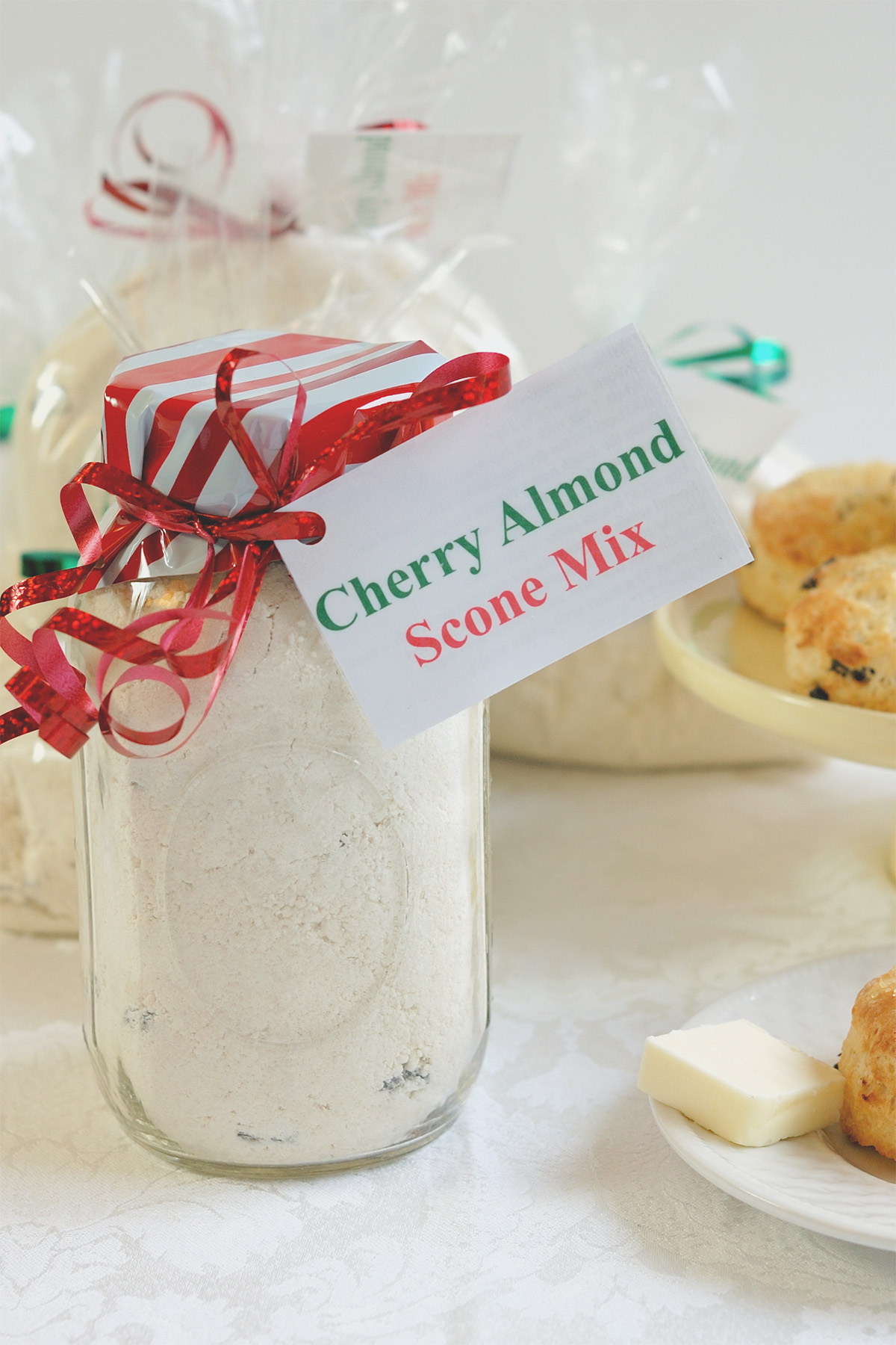 a jar of scone mix with red ribbon and tag.