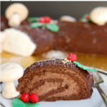 a pinterest image for yule log cake with text overlay.