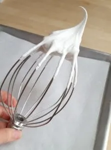 whipped egg whites on a whisk