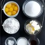 cake ingredients on a black background