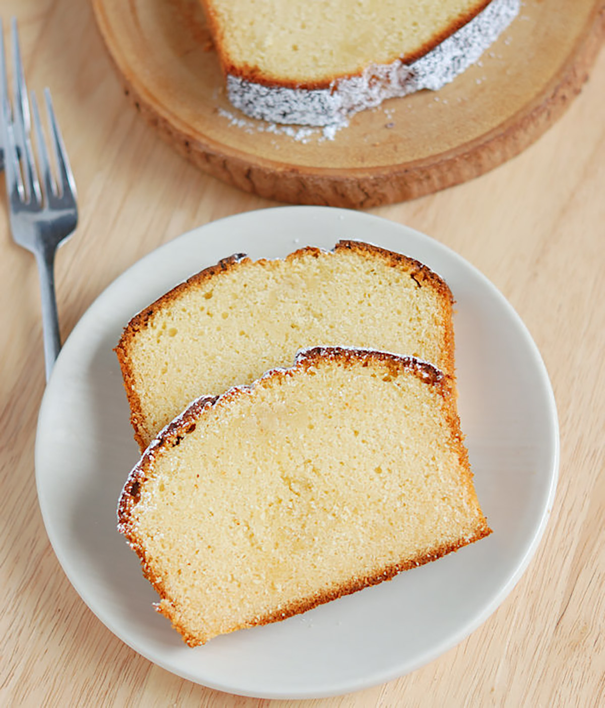 slices of honey pound cake on a white plate.