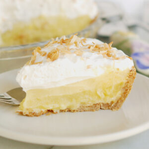 a slice of pina colada pie on a white plate.