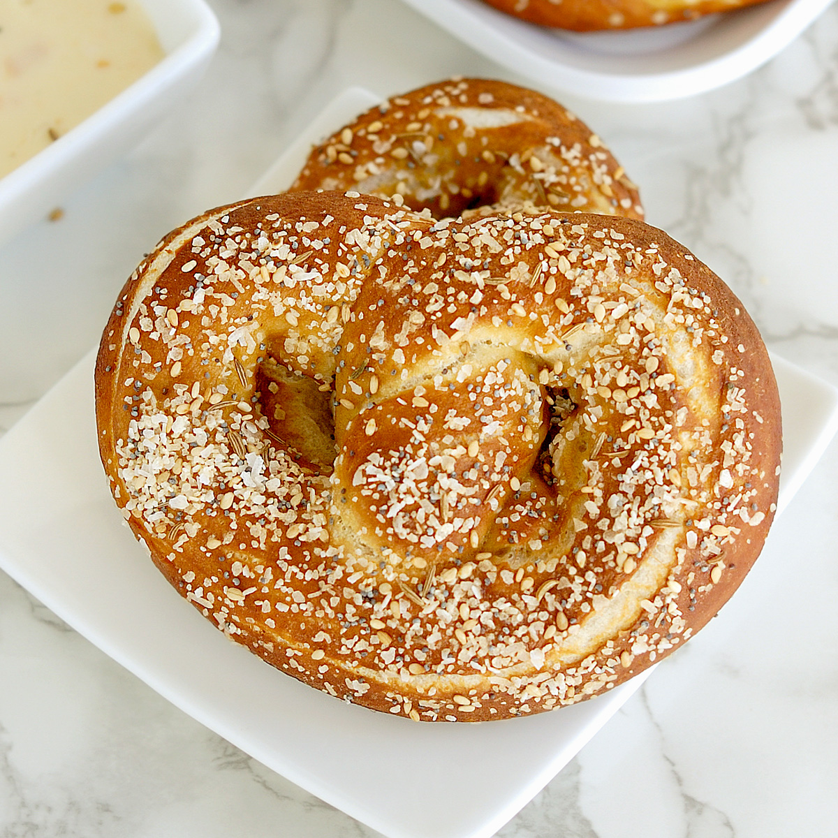 sourdough soft pretzels on a white plate.