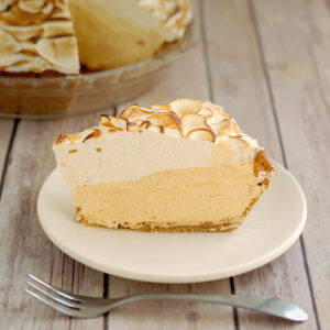 a slice of pumpkin mousse pie on a white plate.