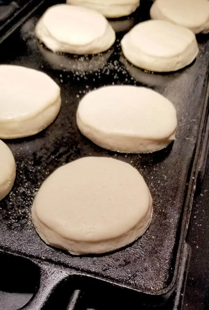 sourdough english muffins on a griddle