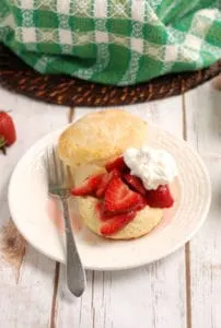 a strawberry shortcake on white plate