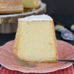 a slice of vanilla chiffon cake on a pink plate.