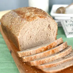 a sliced loaf of whole wheat sourdough bread.