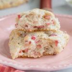 a rhubarb scone on a pink plate.