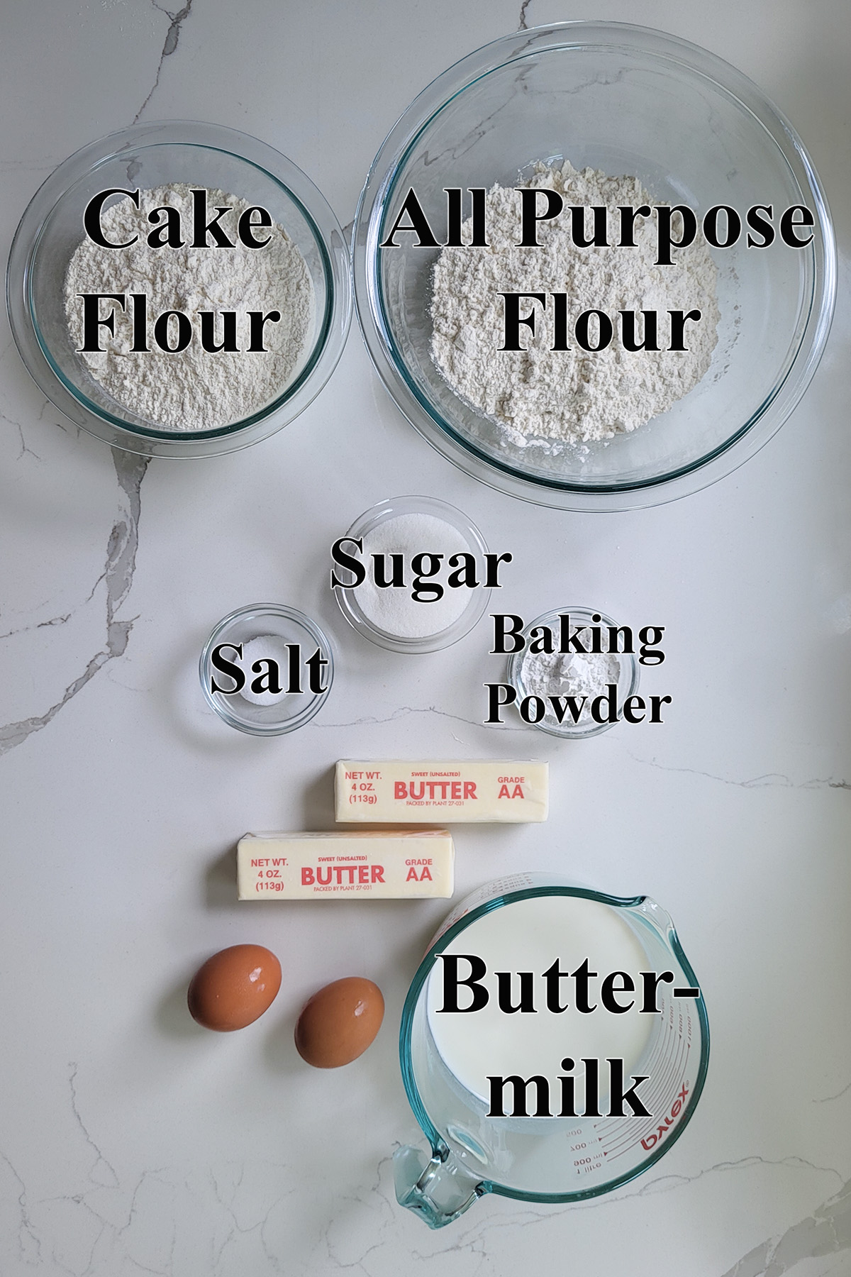 ingredients for shortcake biscuits in glass bowls.