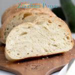 a pinterest image for sourdough bread made with zucchini puree with text overlay.