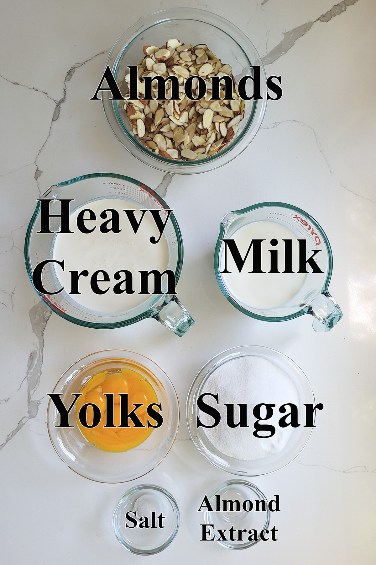 ingredients for toasted almond ice cream in glass bowls.