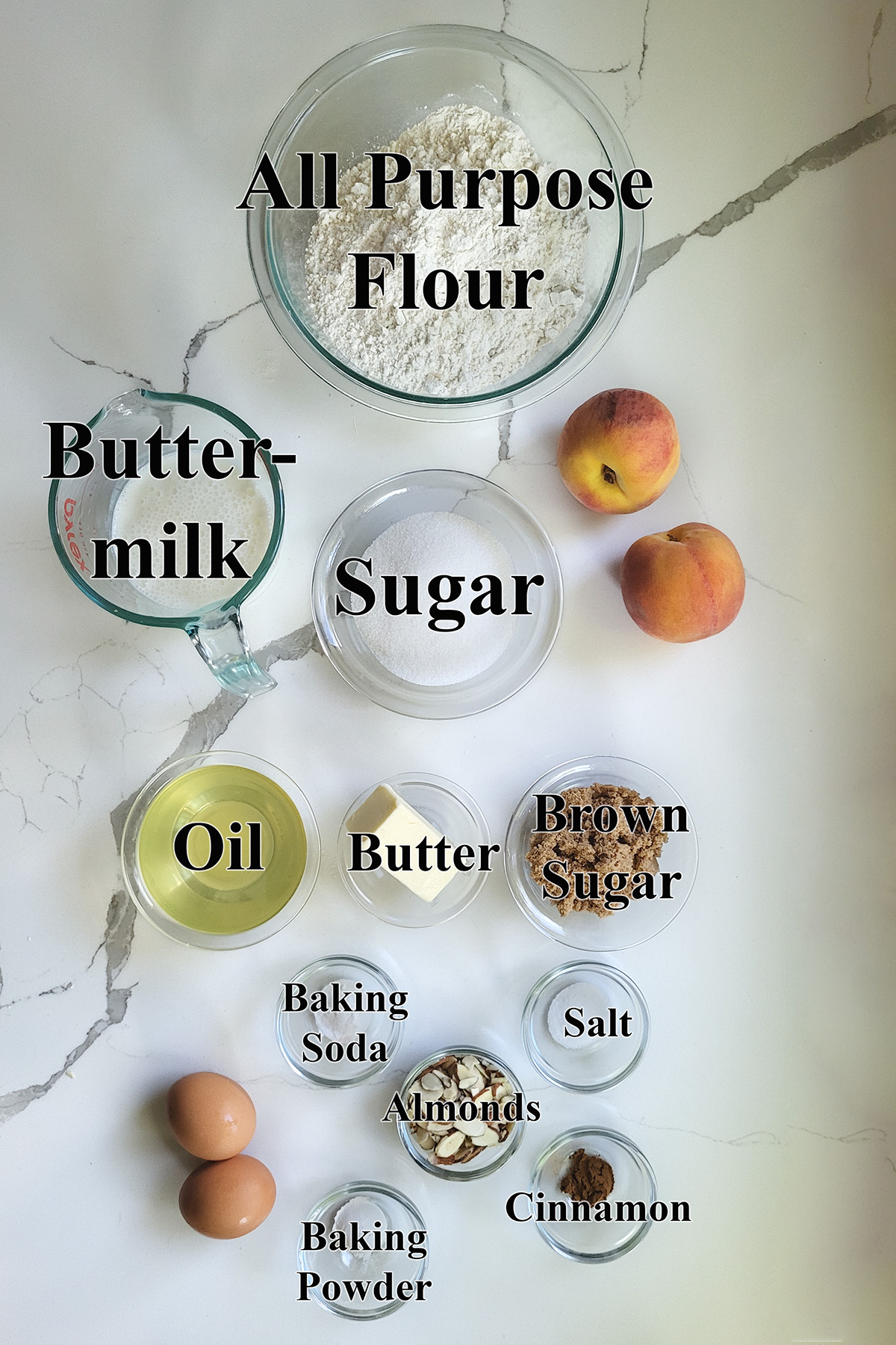 ingredients for peach bread in glass bowls.