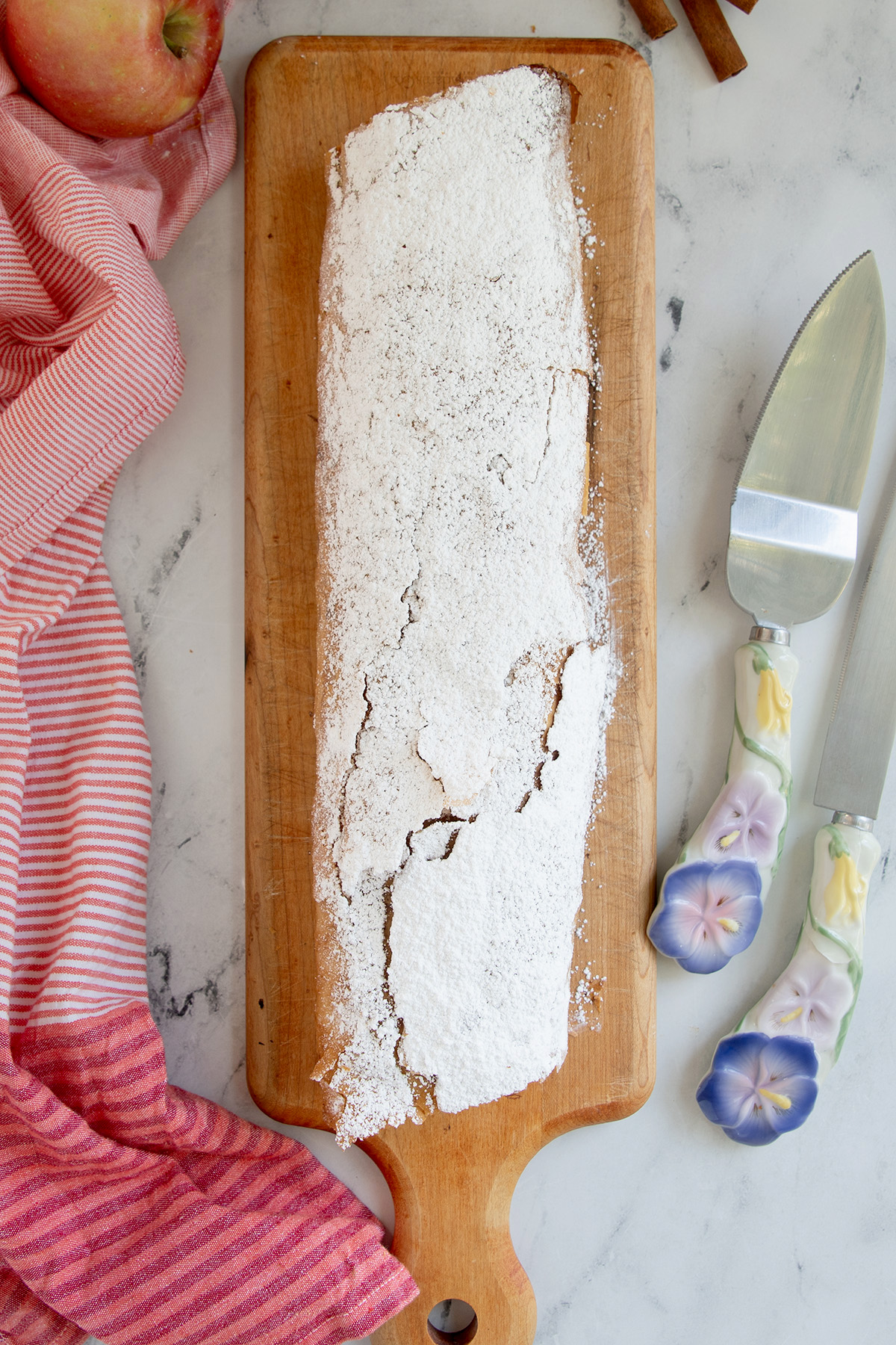 a strudel on a wooden cutting board.