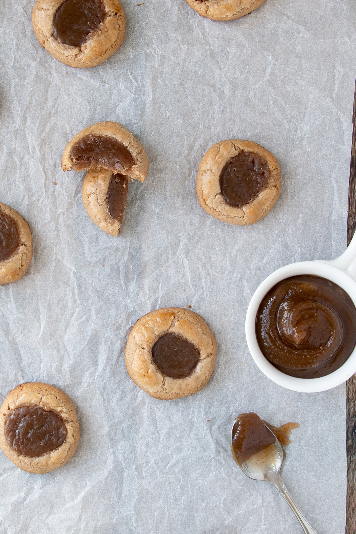 a white paper surface with chestnut cookies and a bowl of chestnut paste.