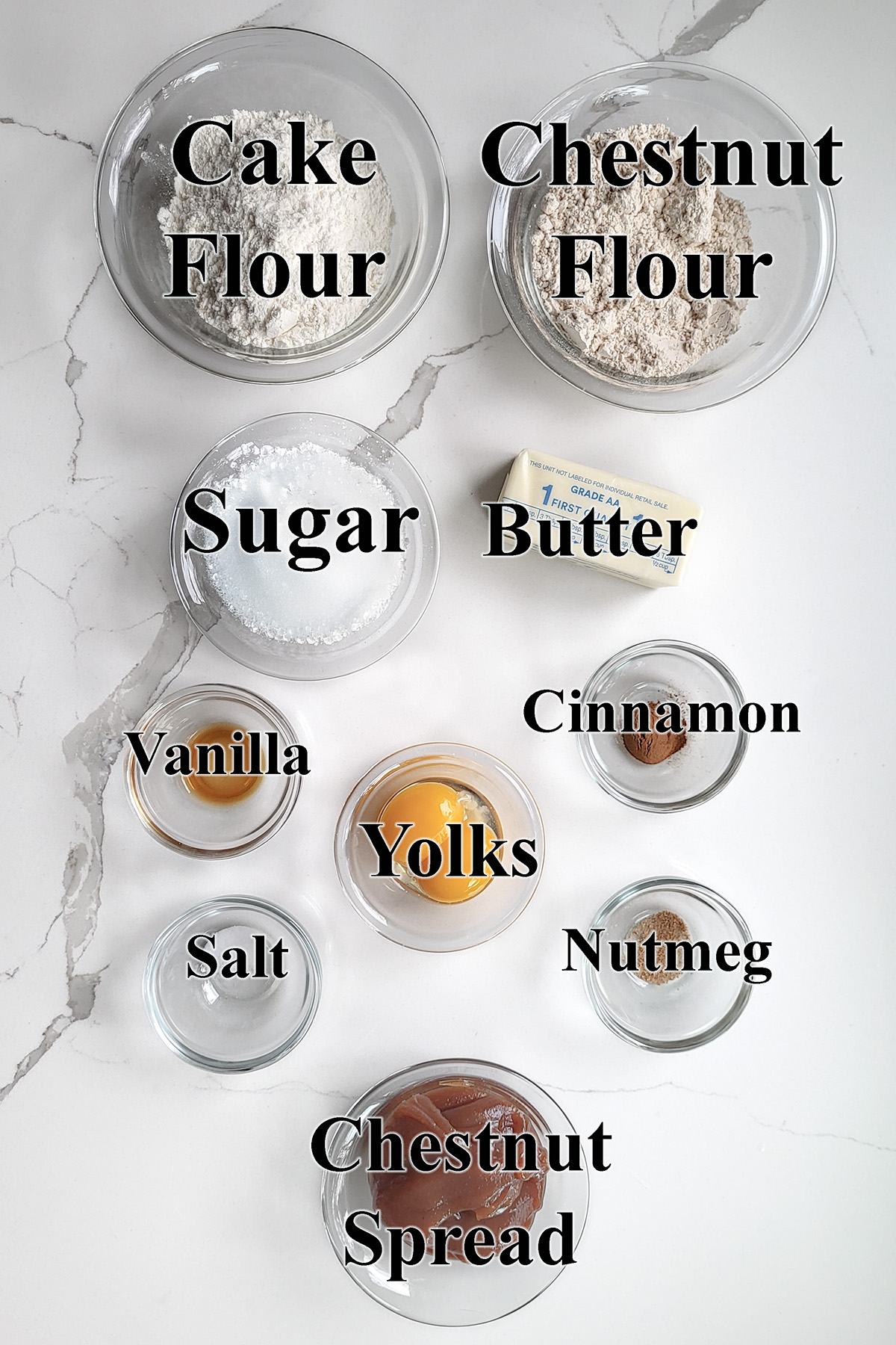 ingredients for chestnut cookies in glass bowls.