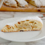 a slice of sourdough stollen on a white plate.