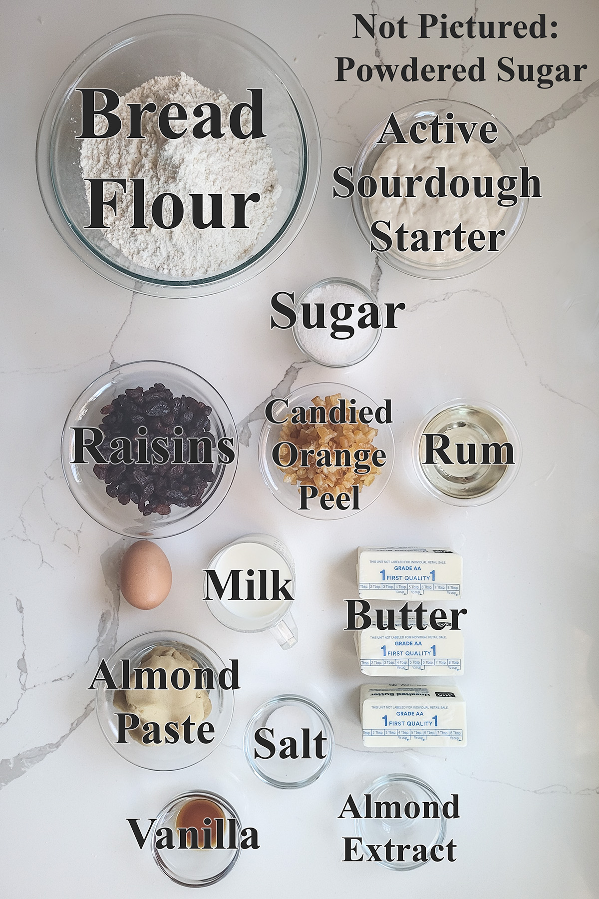 ingredients for sourdough stollen in glass bowls.