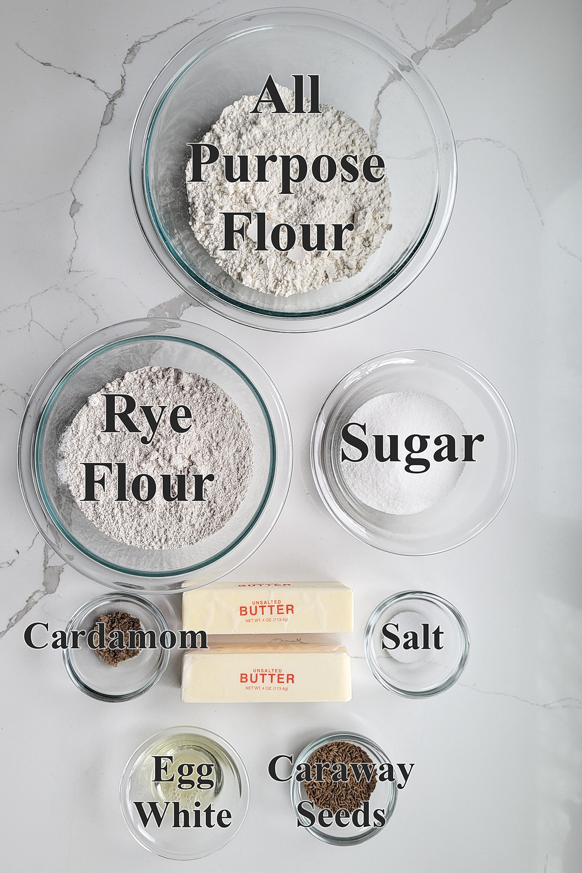 ingredients for rye cookies in glass bowls.