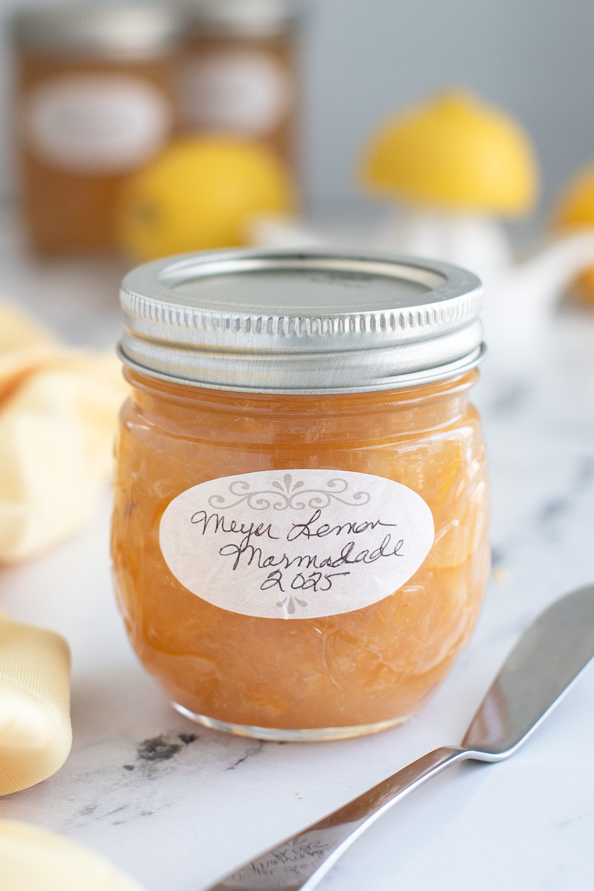 a jar of meyer lemon curd with a label on front.