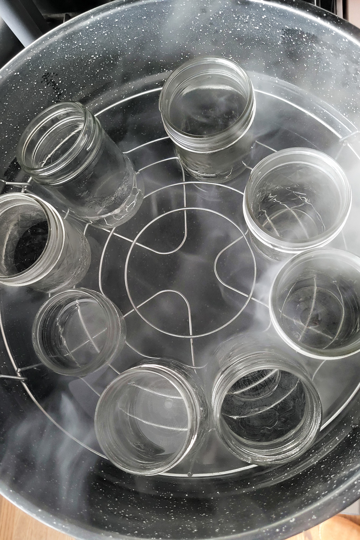 canning jars in a pot of boiling water.