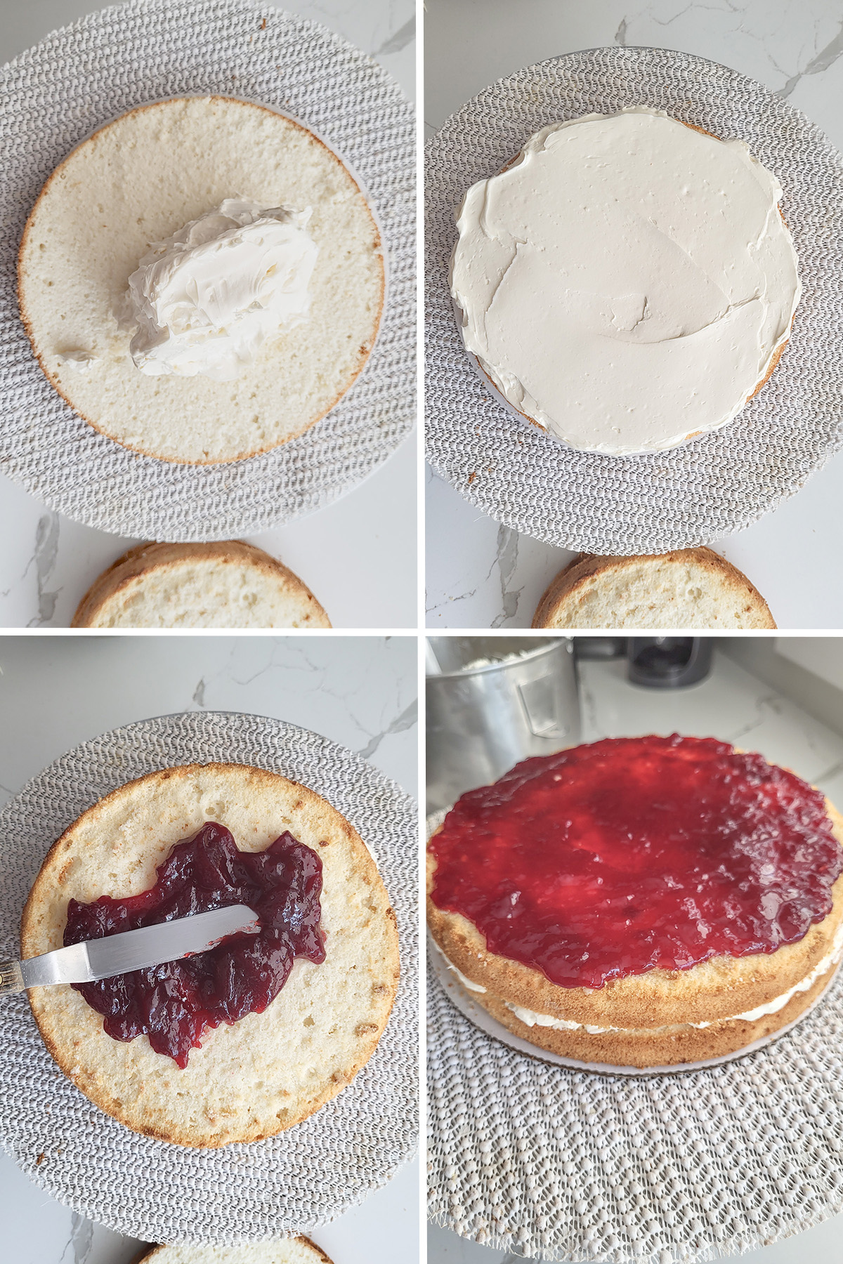 cake layered with buttercream an raspberry preserves on a cake turn table.