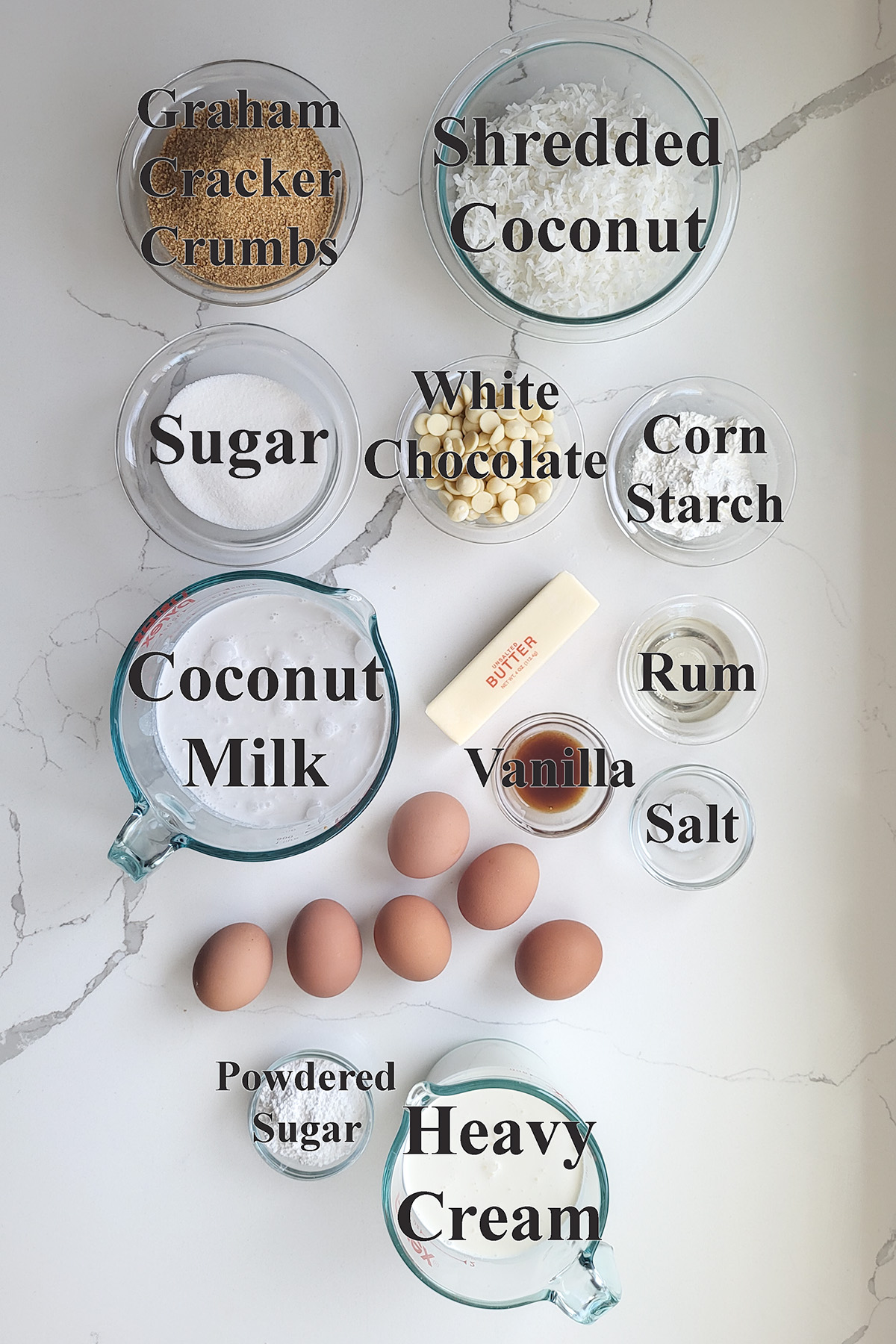 ingredients for coconut cream pie in glass bowls.